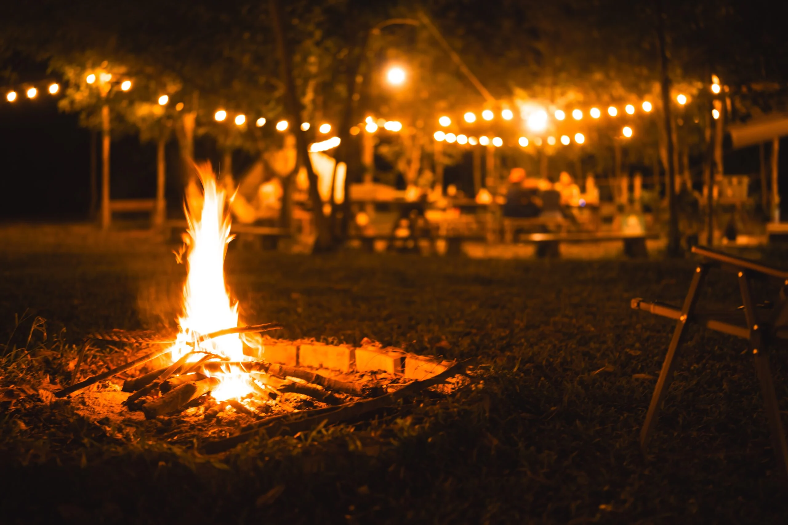 Bonfire under stars at a mountain camp